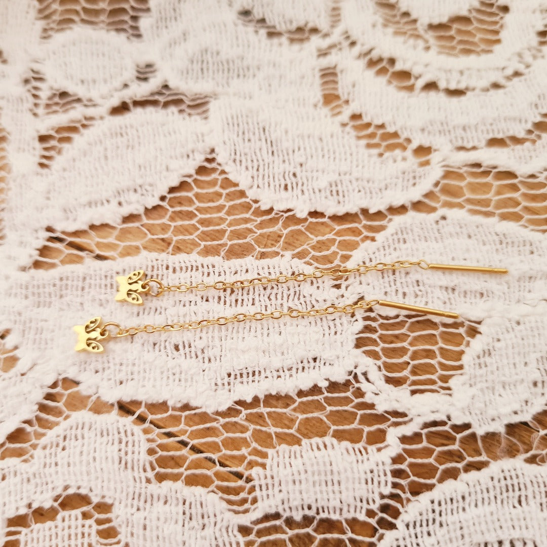 Ketting oorbellen goud met vlinderbedel