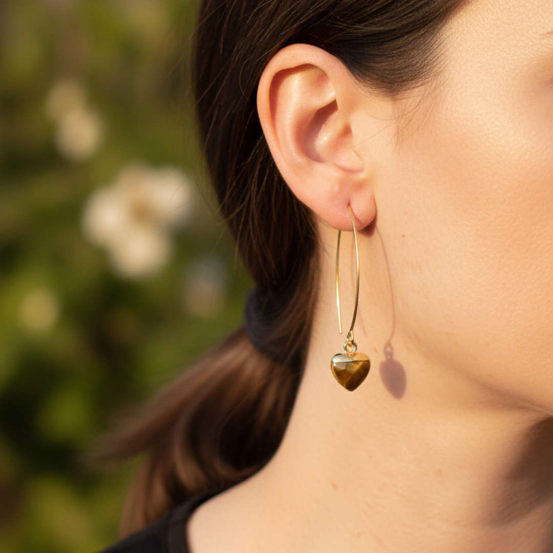 Gold half-heart tiger's eye earrings