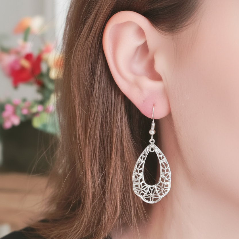 Silver filigree earrings with flawless skin