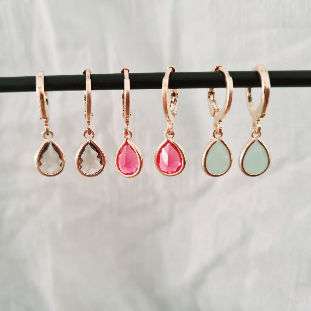 Goudkleurige ringetjes met mintgroen steentje