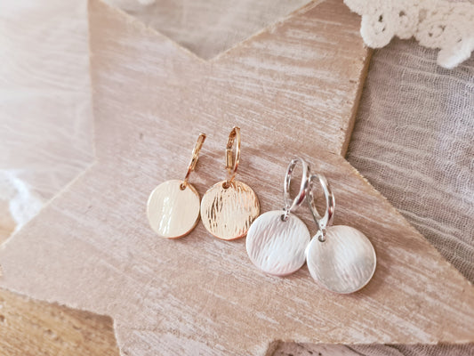 leike ringetjes in zilver en goud met munt hanger