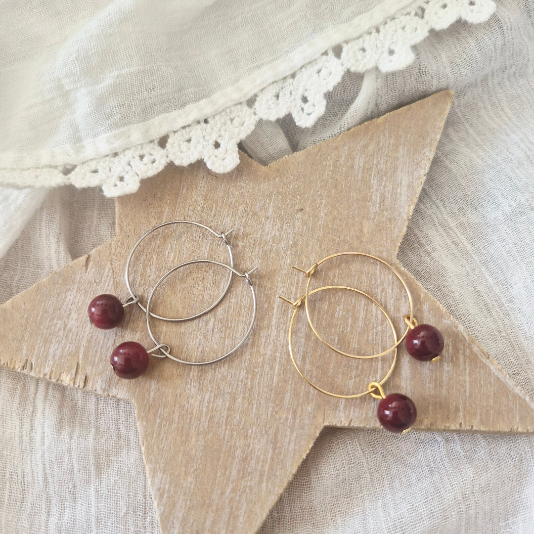 Ringen bordeaux kraal stainless steel goud zilver