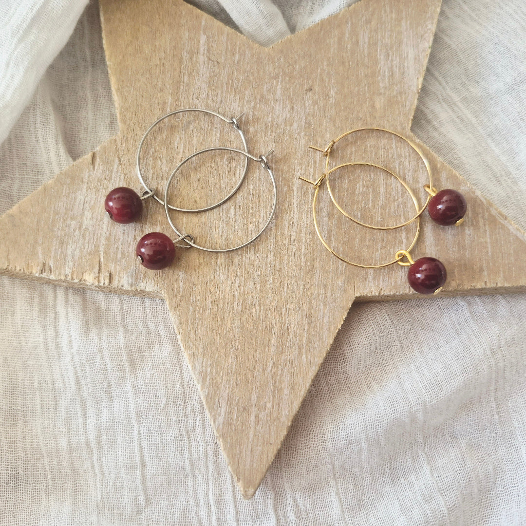 Ringen bordeaux rode kraal goud zilver varianten