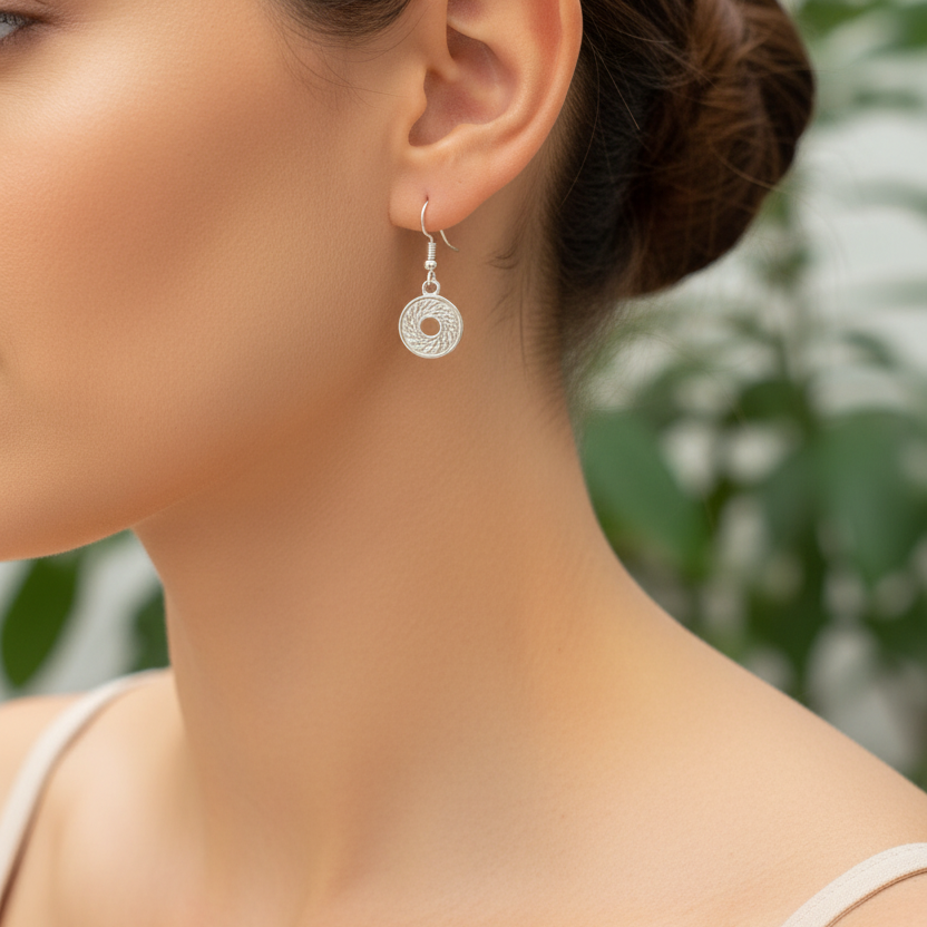 Zilveren muntje oorbellen gedragen correct