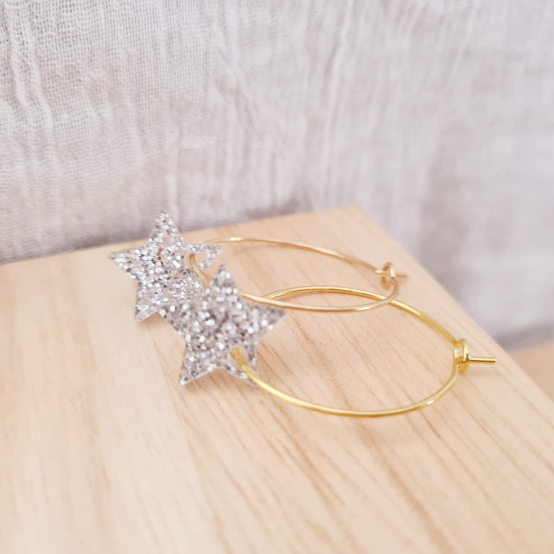 Gouden ringen met plex ster bedel in zilver glitter nikkelvrij